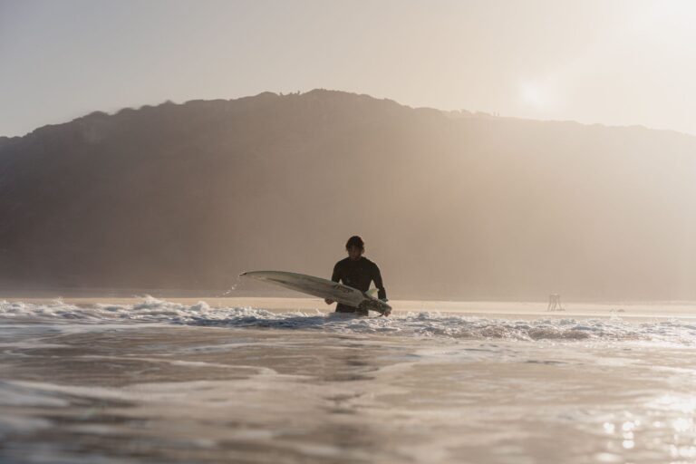 surf guide algarve guest with surfboard