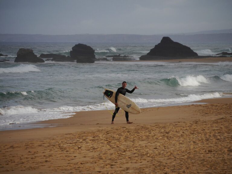 surf guide algarve guest stoked at the beach of Castelejo