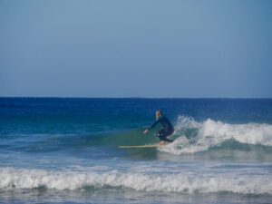 surf guide algarve longboard session going right at beliche