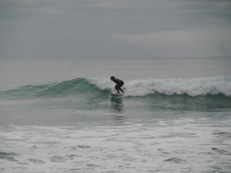 clean waves porto de mos surf girl with surf guide algarve