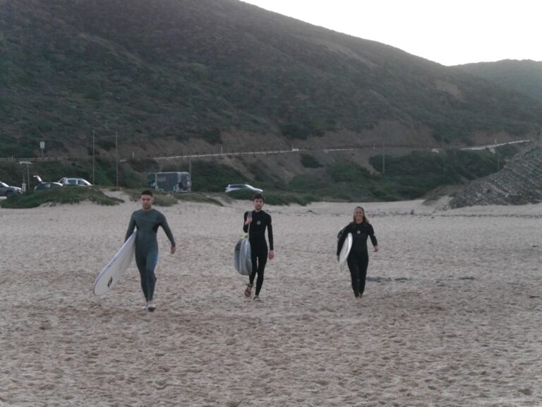 mother and two sons surfing with surf guide algarve